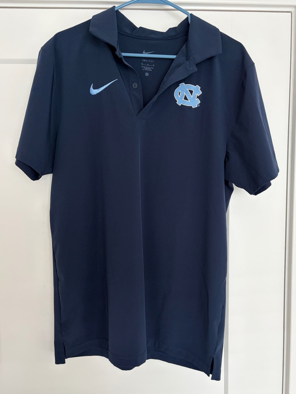 Nike Men's Navy Polo with UNC Carolina Blue Logo